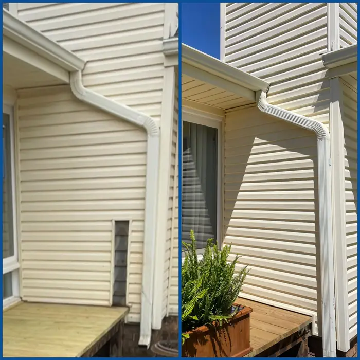 The corner of a house where the siding meets the gutter and downspout, cleanly finished